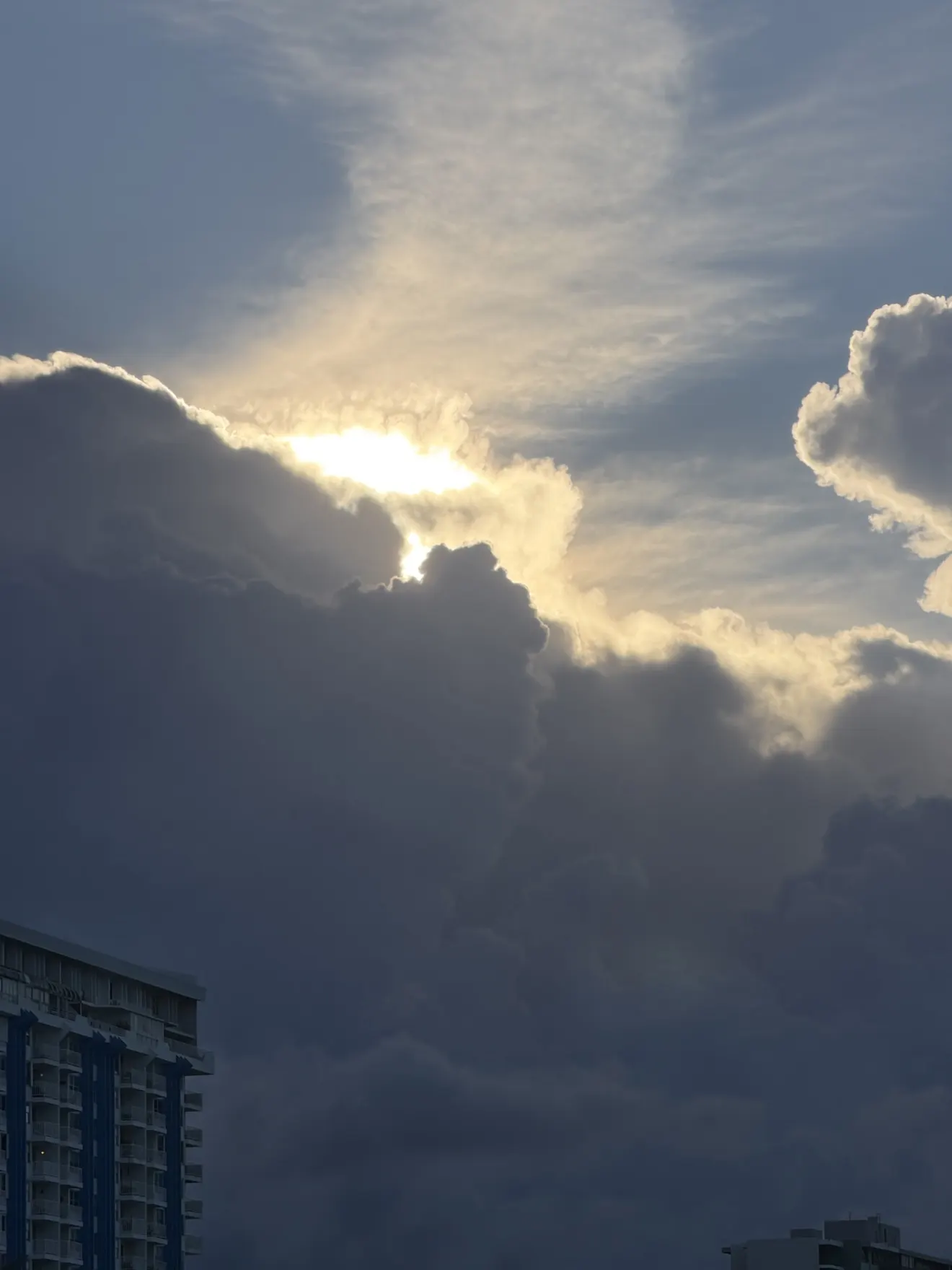 Evening sunlight breaking through clouds above Isla Verde