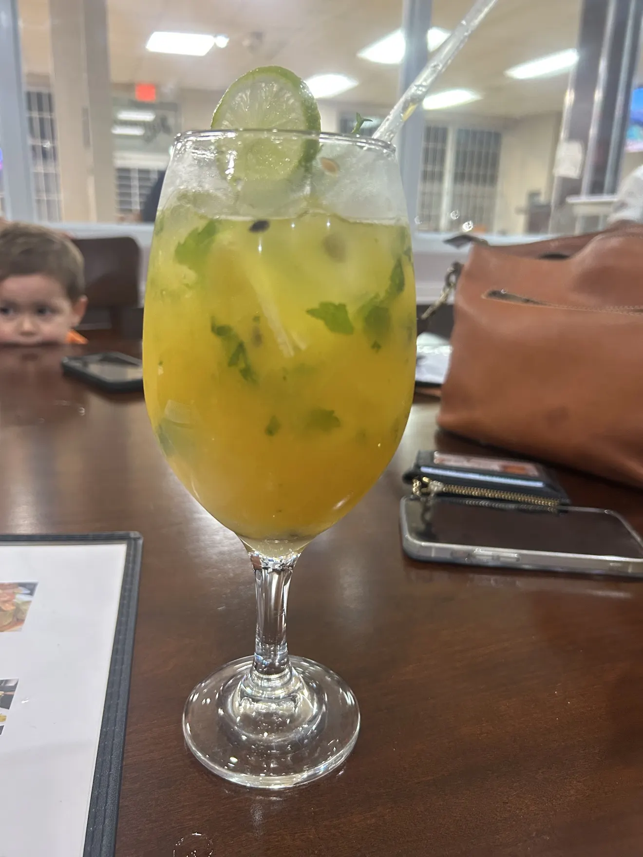 Passion fruit mojito garnished for serving