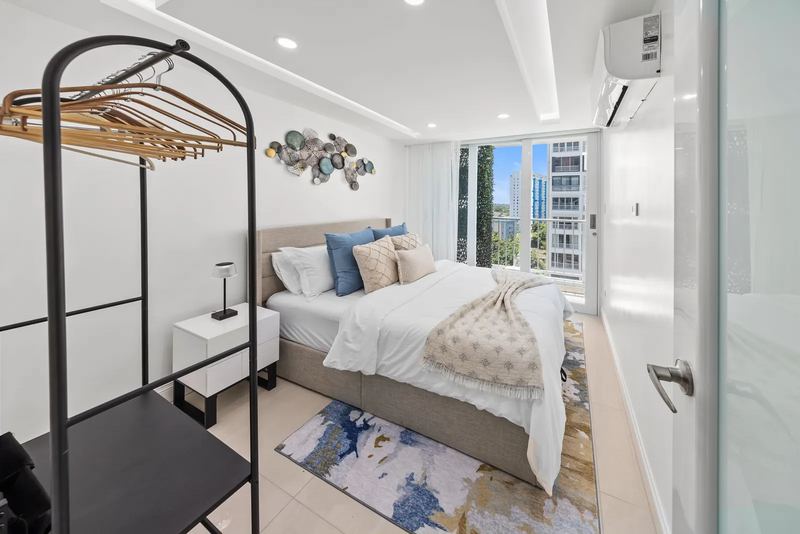 Maréa bedroom with queen bed and coastal blue accents