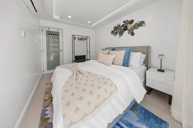 Maréa bedroom with warm coastal styling