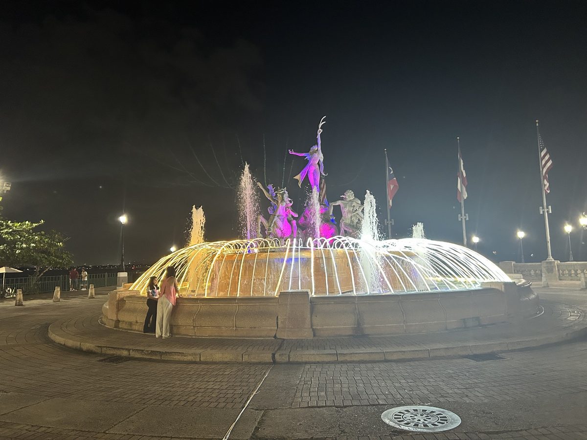 The Raíces fountain in Old San Juan lit at night