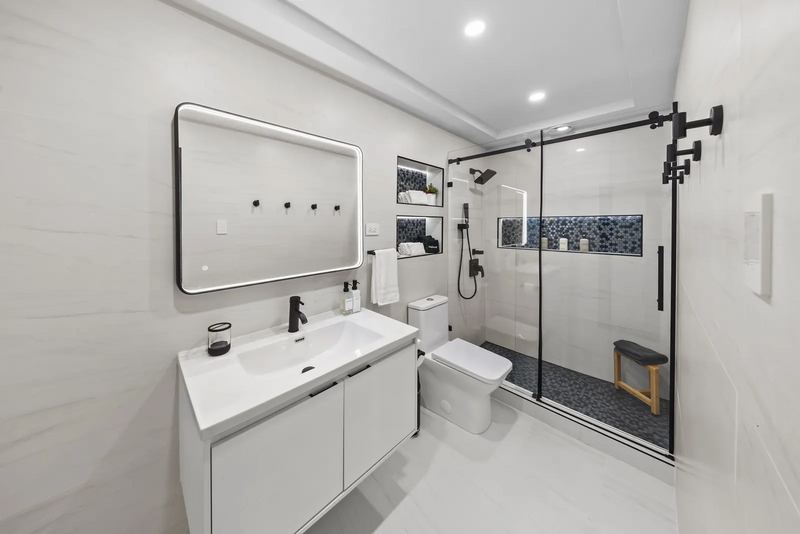 Terra Noir bathroom with double vanity and glass shower